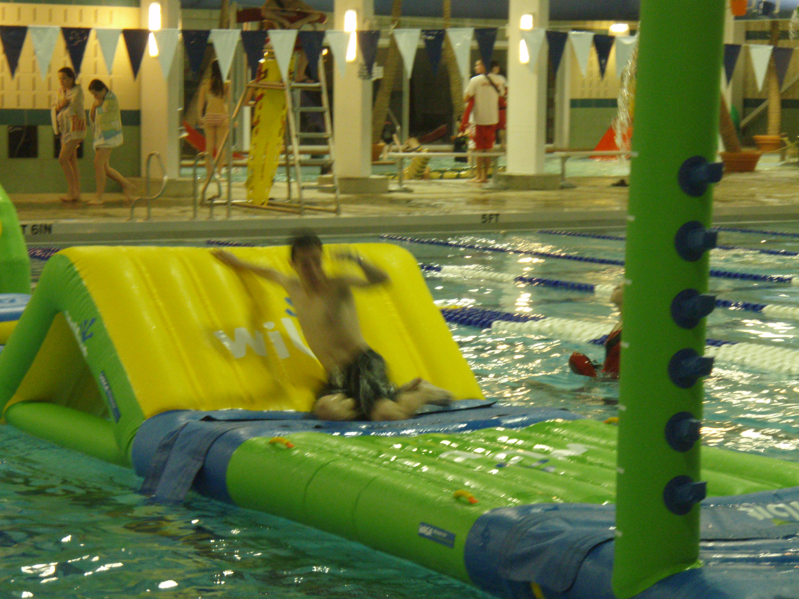 Teen sliding down the Wibit 